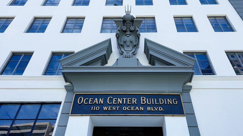 the facade of the ocean center building with a sign in front of it