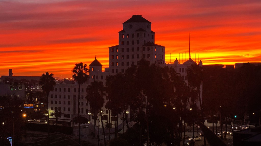 the sun sets over the city