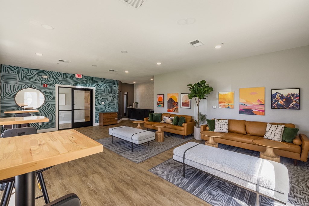 a living room with couches and chairs and a table