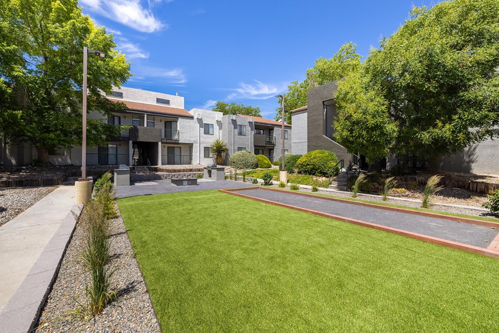 the yard of a house with a lawn and a sidewalk