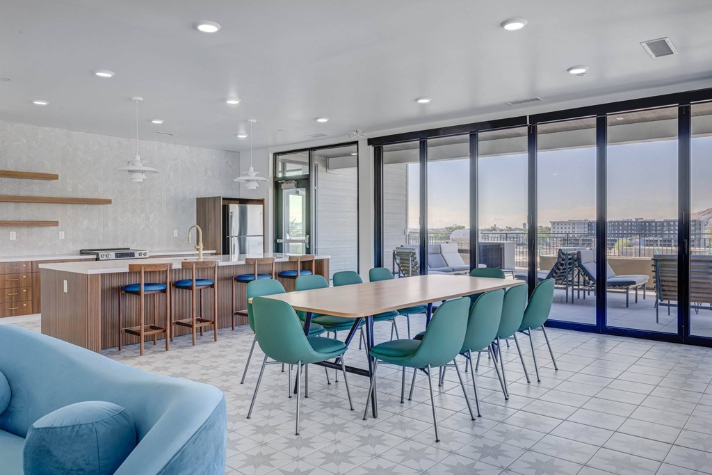 A modern dining room with a large table and chairs.