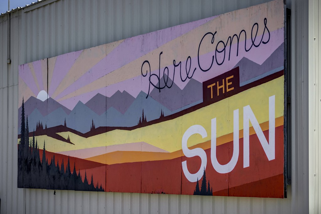 A mural on a building wall says