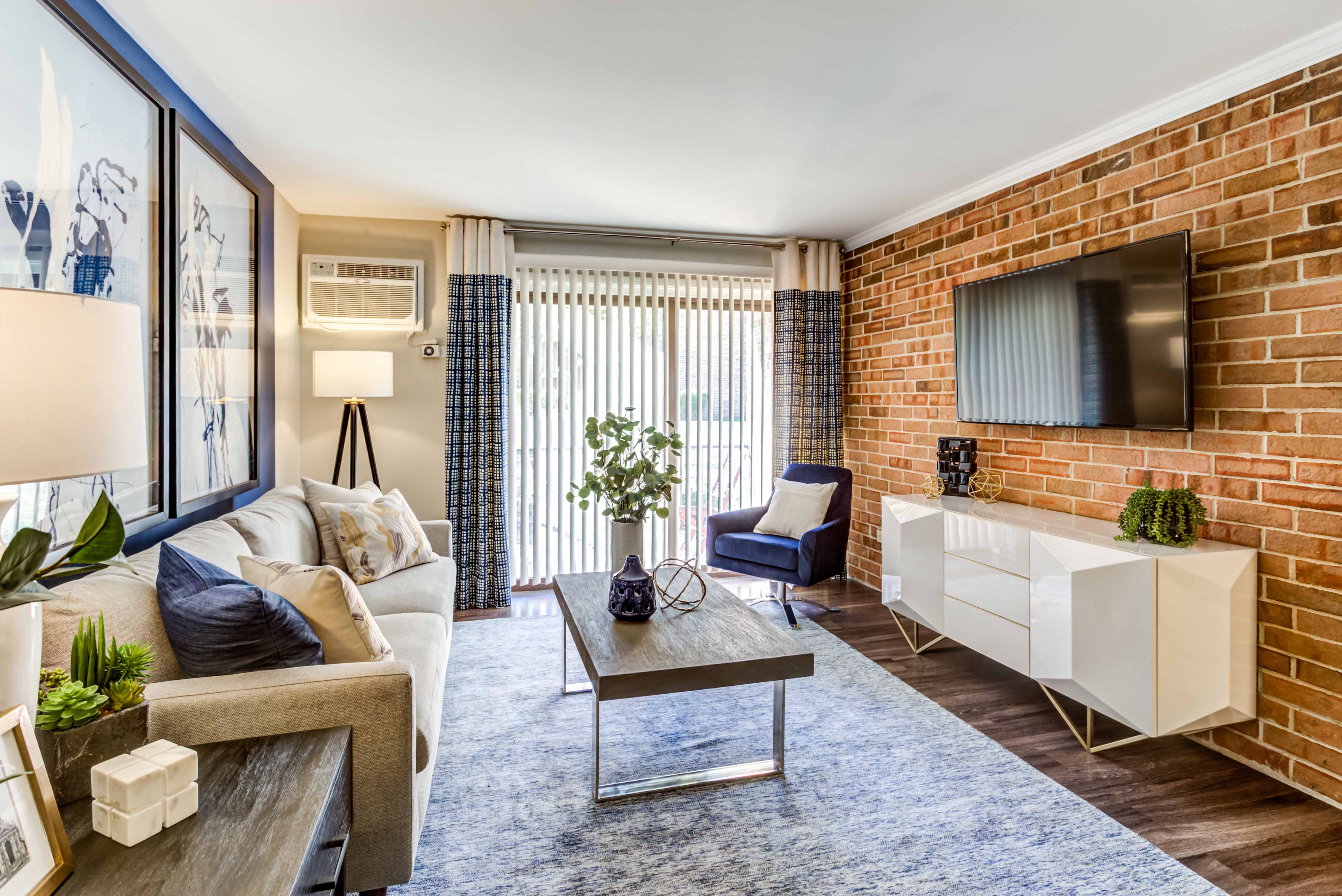 a living room with a couch and a tv