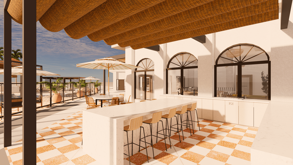 a bar area at a resort with chairs and umbrellas