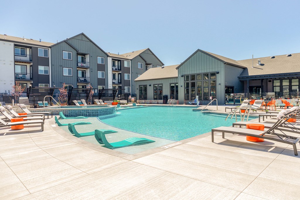 our apartments have a large swimming pool with lounge chairs