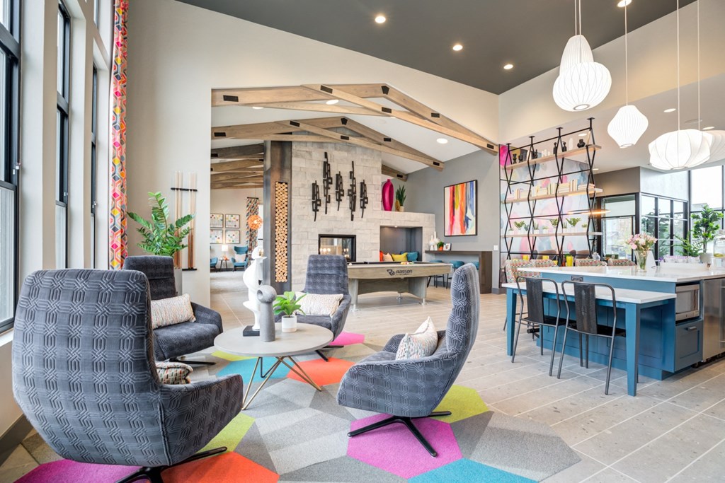 a living room and dining room with chairs and tables