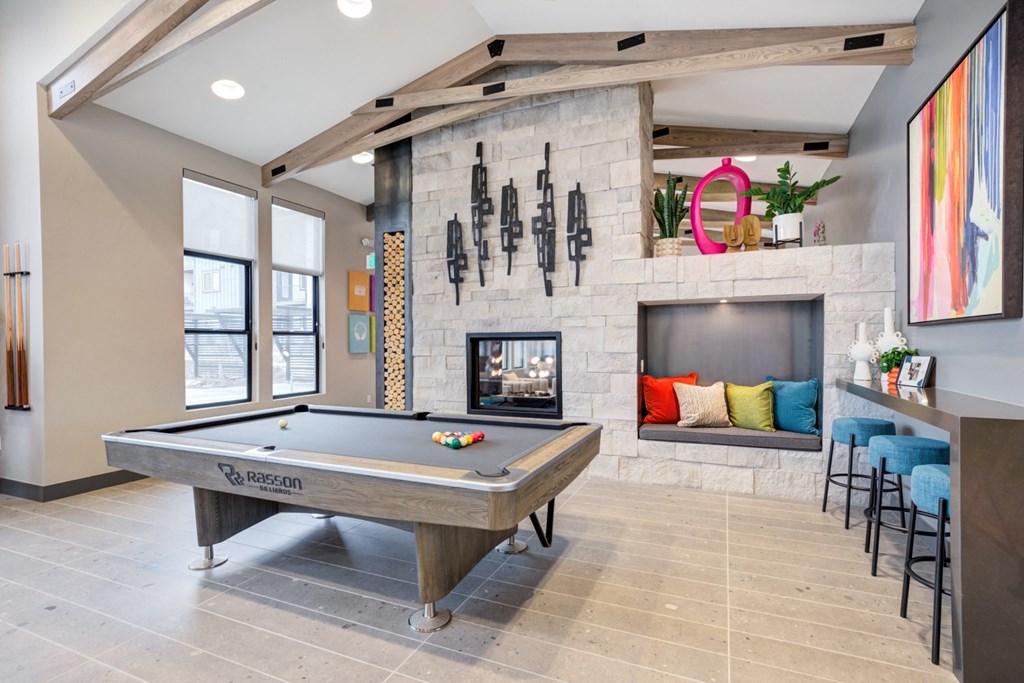 the preserve at ballantyne commons game room with pool table and fireplace
