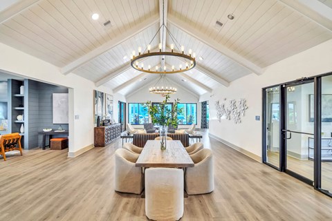 Elegant resident lounge with comfortable seating and modern coastal-inspired décor