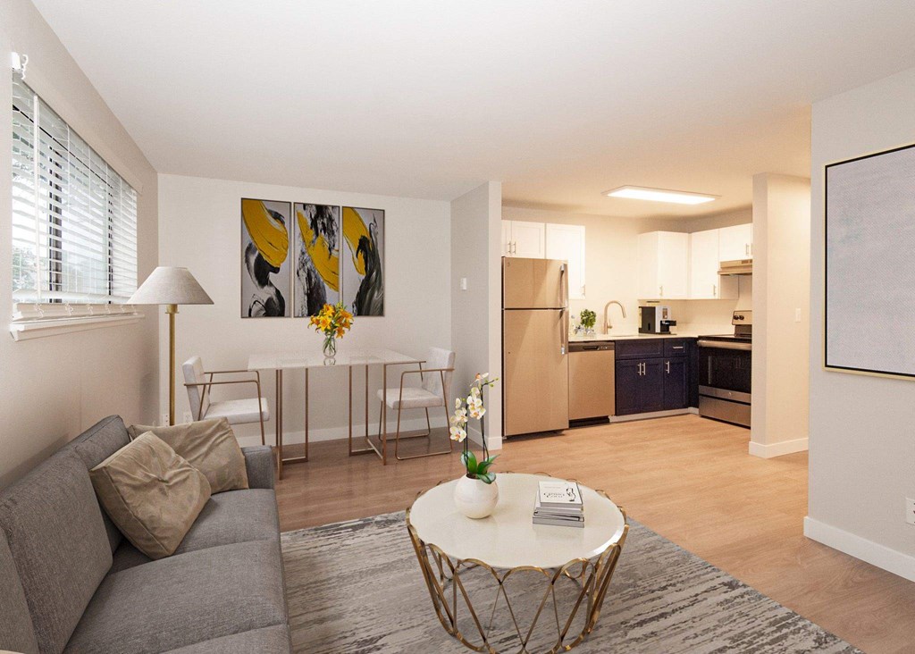A living room with a grey couch and a white coffee table at Aspenridge Apartments,Washington 98683