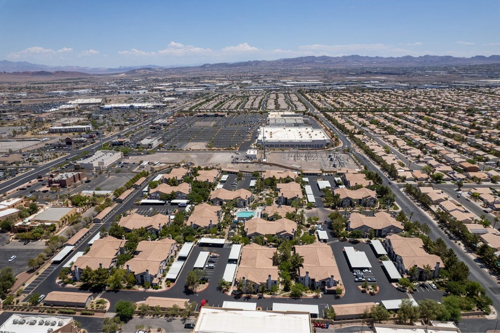 A large aerial view of a commercial area with buildings and roads.