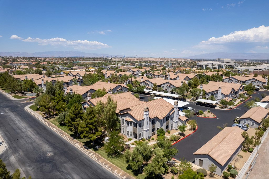 A residential area with houses and a road.