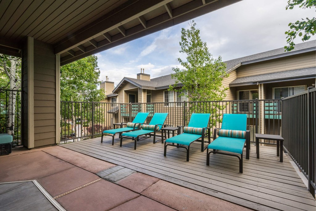 A Patio With Blue Chairs at The Summit at Flagstaff, Flagstaff