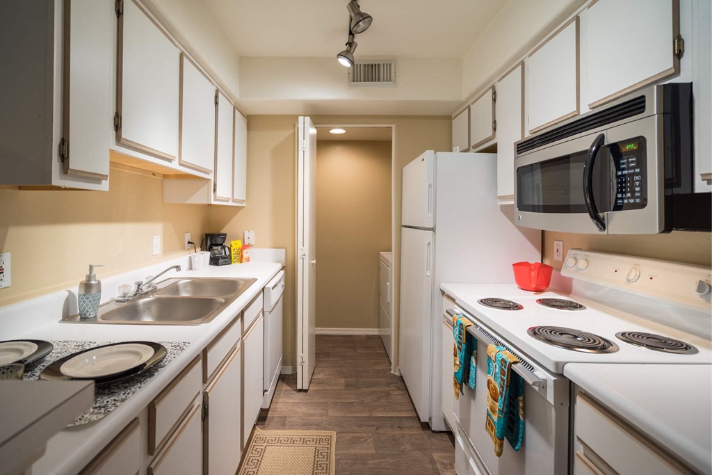 A Kitchen With White Appliances at The Summit at Flagstaff, Flagstaff