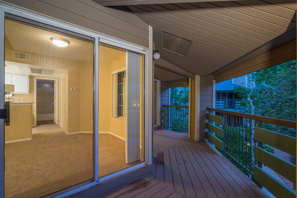 A Balcony With a Glass Door at The Summit at Flagstaff, Flagstaff