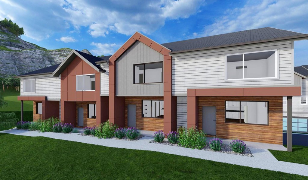A modern house with a grey roof and brown sidings.