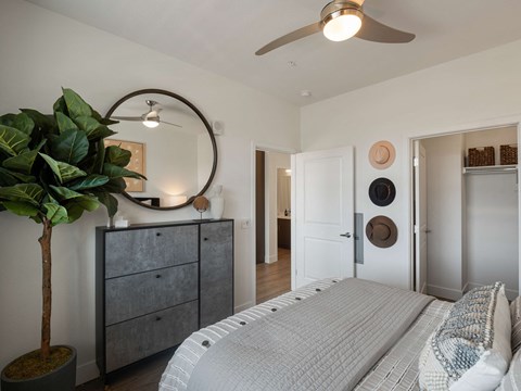 Bedroom with a ceiling fan and closet