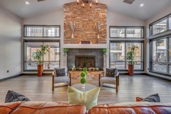 Large clubhouse with vaulted ceilings, pool table, sitting area, and fireplace - Photo Gallery 9