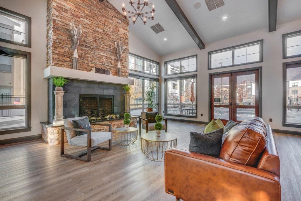 Large clubhouse with vaulted ceilings, pool table, sitting area, and fireplace