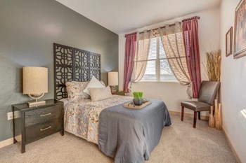 Carpeted Bedroom, with queen size bed, and large windows - Photo Gallery 5