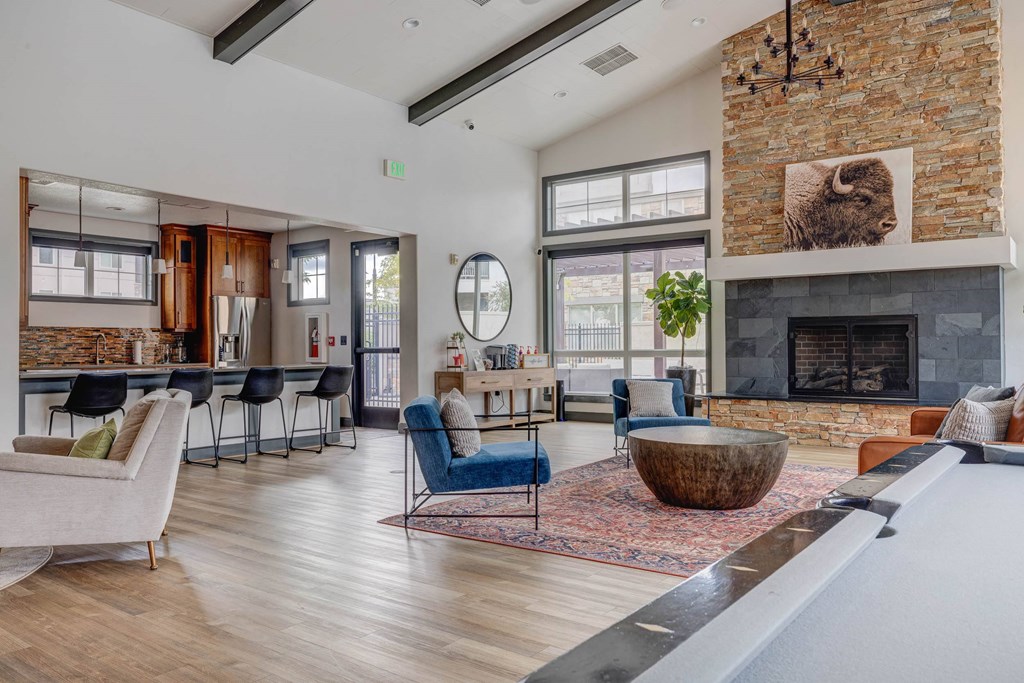 A living room with a fireplace and a pool table.