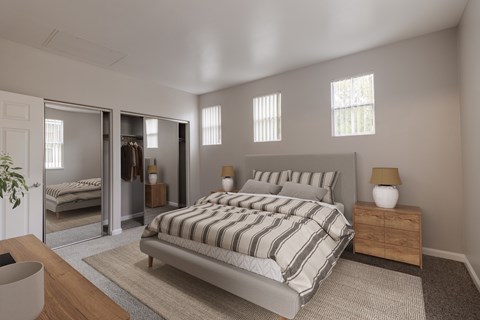 A bedroom with a large bed and a mirrored closet.