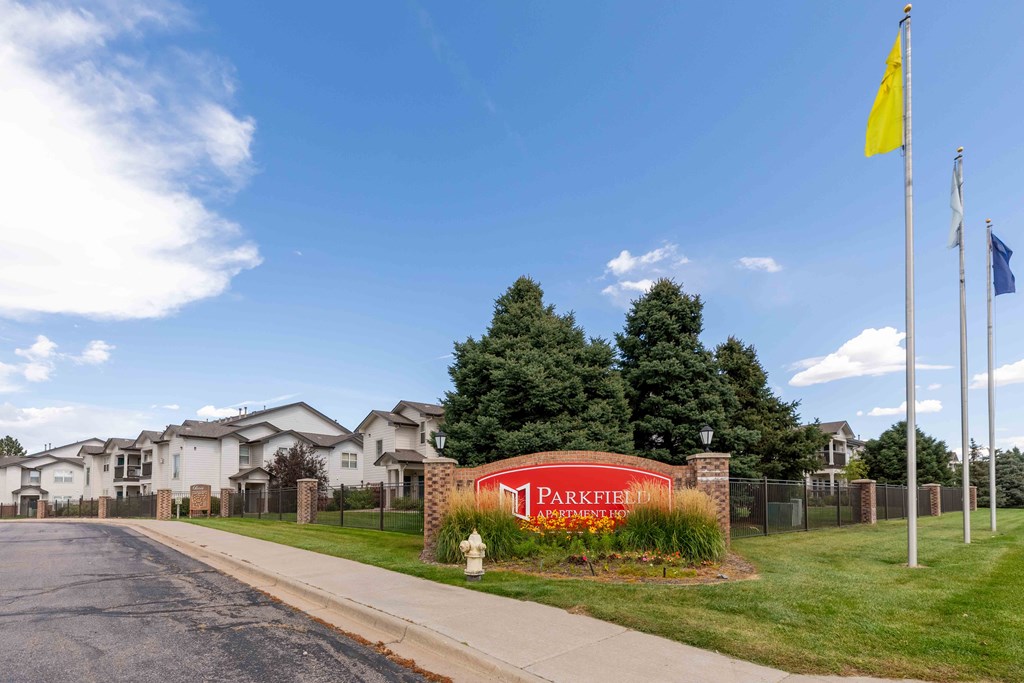 Parkfield sign with apartment buildings on the side of the road