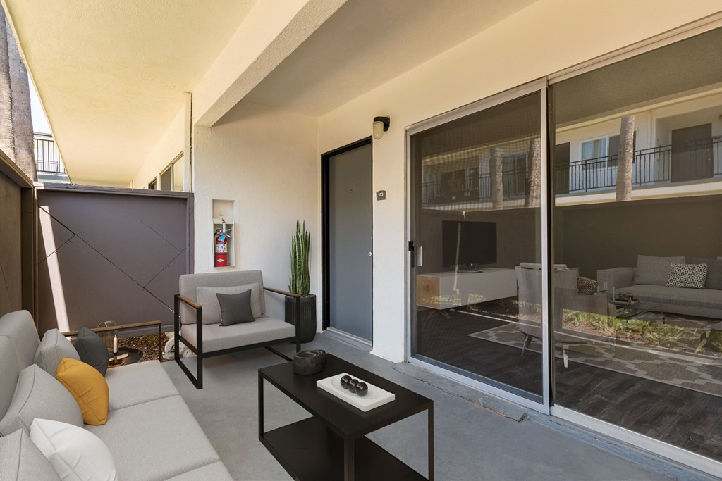 a living room with a white couch and a coffee table
