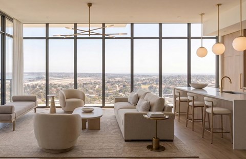 A modern living room with a view of the city.