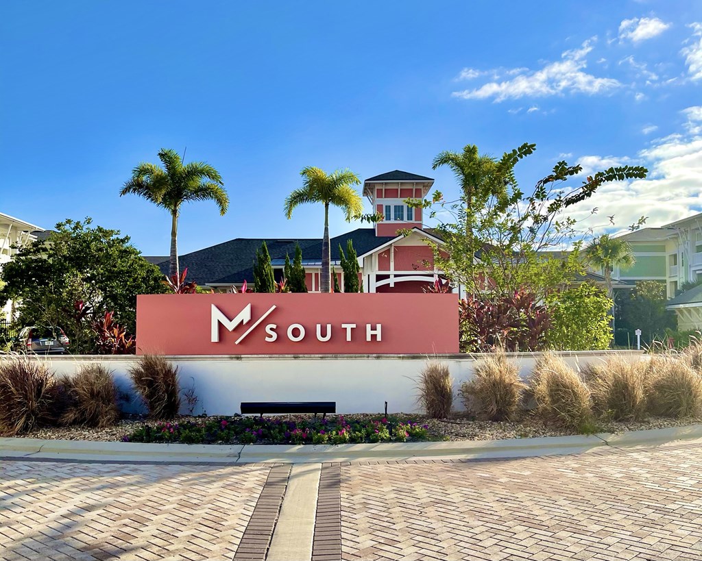 A building with a sign that says M SOUTH in front of it.