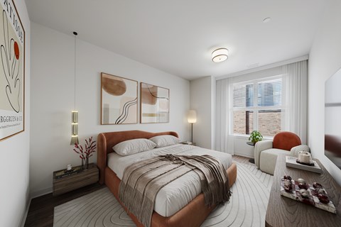 A bedroom with a large bed and a window with blinds.