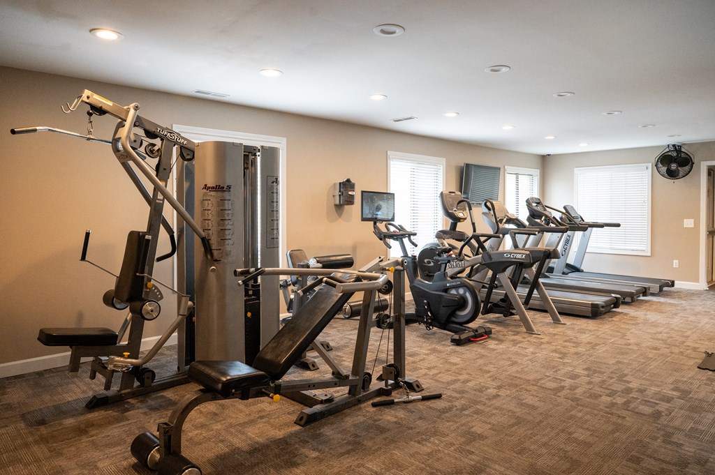 a room filled with lots of different types of exercise equipment