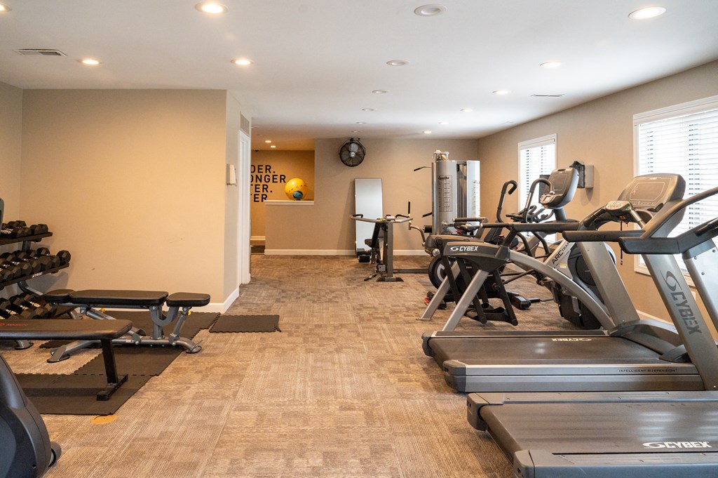 a room filled with lots of different types of exercise equipment