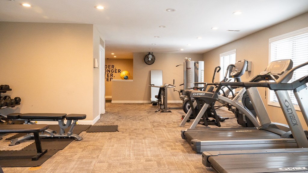 a room filled with lots of different types of exercise equipment