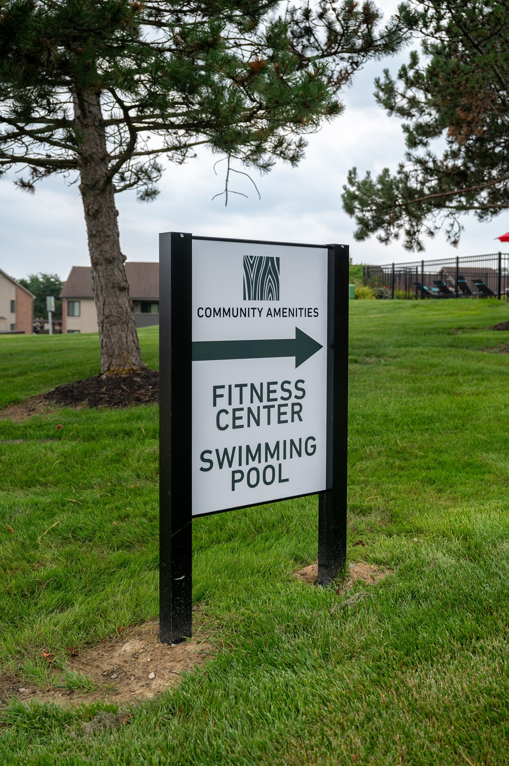a sign for the fitness center and swimming pool