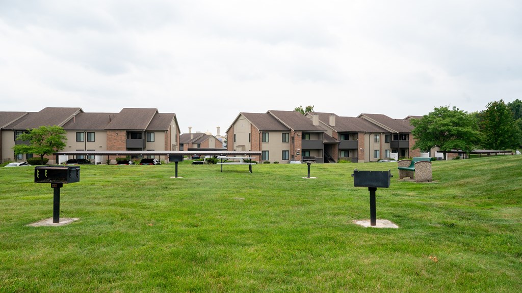 a park with houses in the background