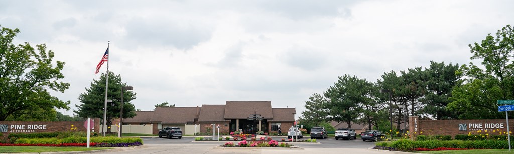 a large building with a flag in front of it