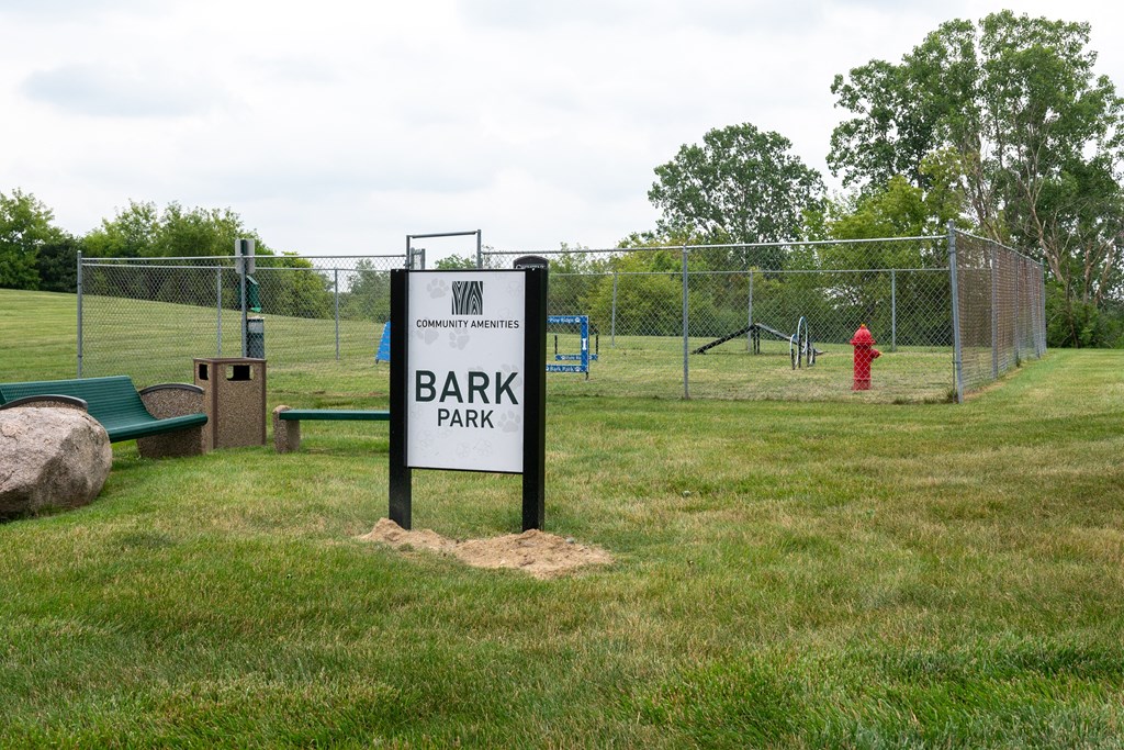 a park with a sign that says bark park