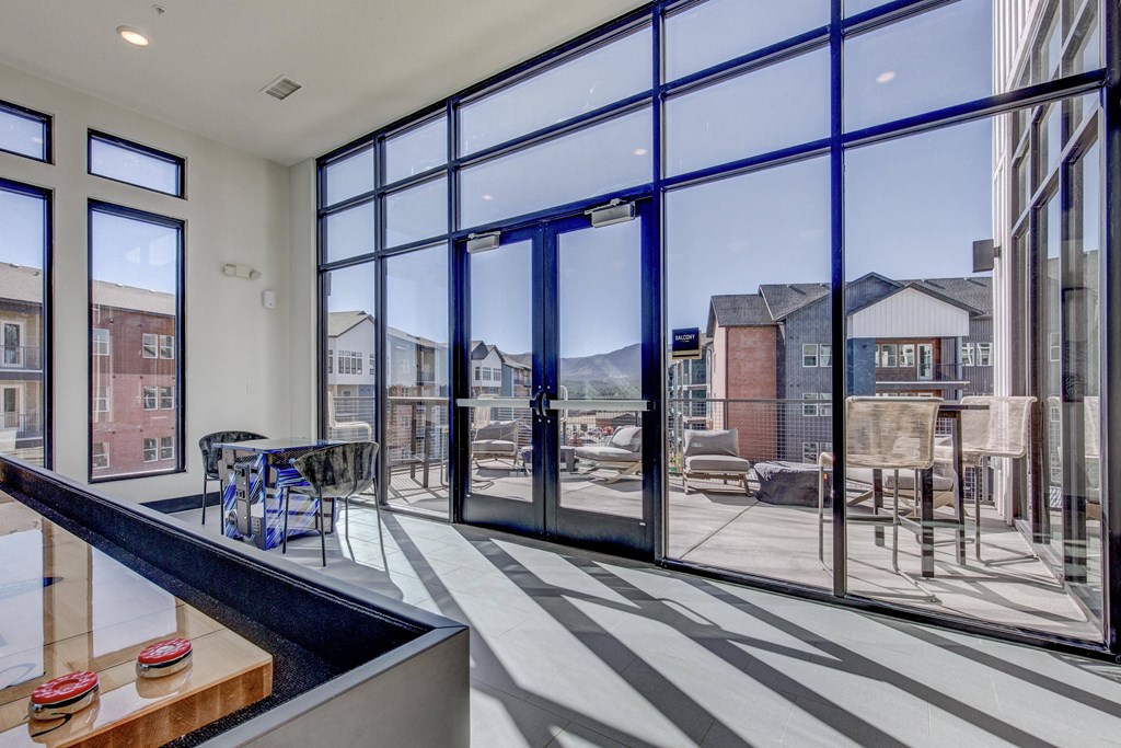 Inside sky deck lounge with view to outdoor sky deck space