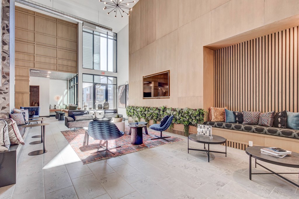 Great room seating space with TV and live plant wall