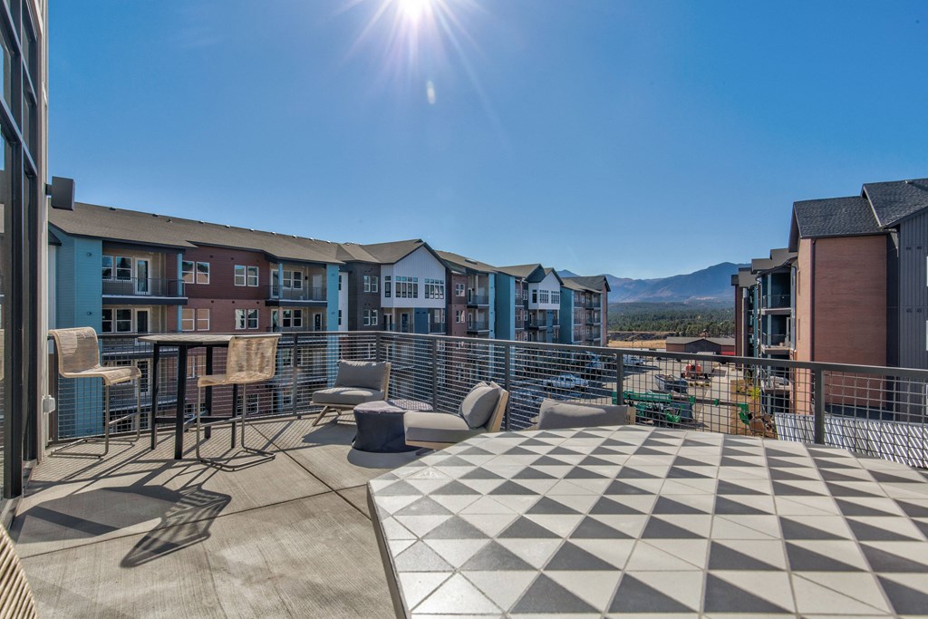 Outdoor sky deck  with seating and mountain views