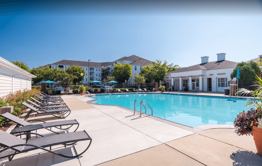 Pool with seating and umbrellas