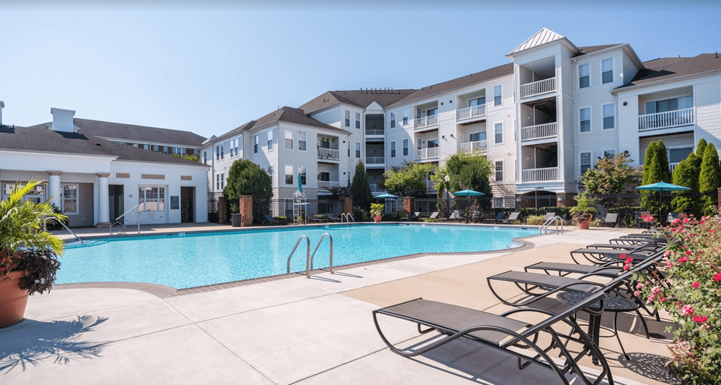Pool with seating and umbrellas