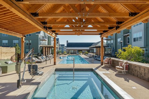 Resort-style pool and soaking area at PARK40, our Broomfield Colorado apartments in the Baseline community.