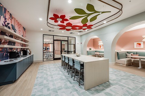 a dining room with a long table and chairs in a lobby