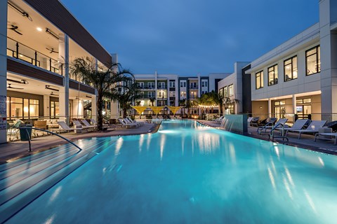 a swimming pool at night at the resort