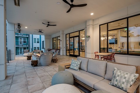 a living room with couches and chairs and a patio