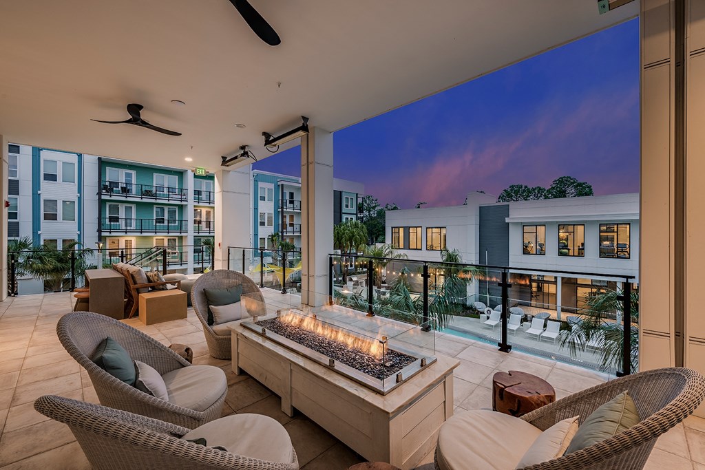 a view of a living room with a fireplace and a pool