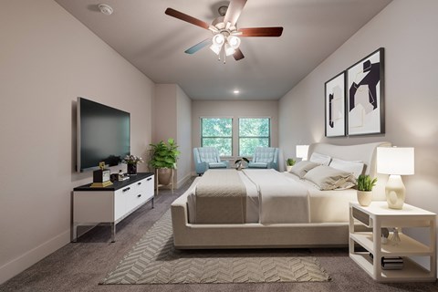 a bedroom with a large bed and a ceiling fan