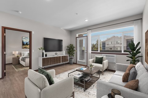 A modern living room with a large window overlooking a residential area.