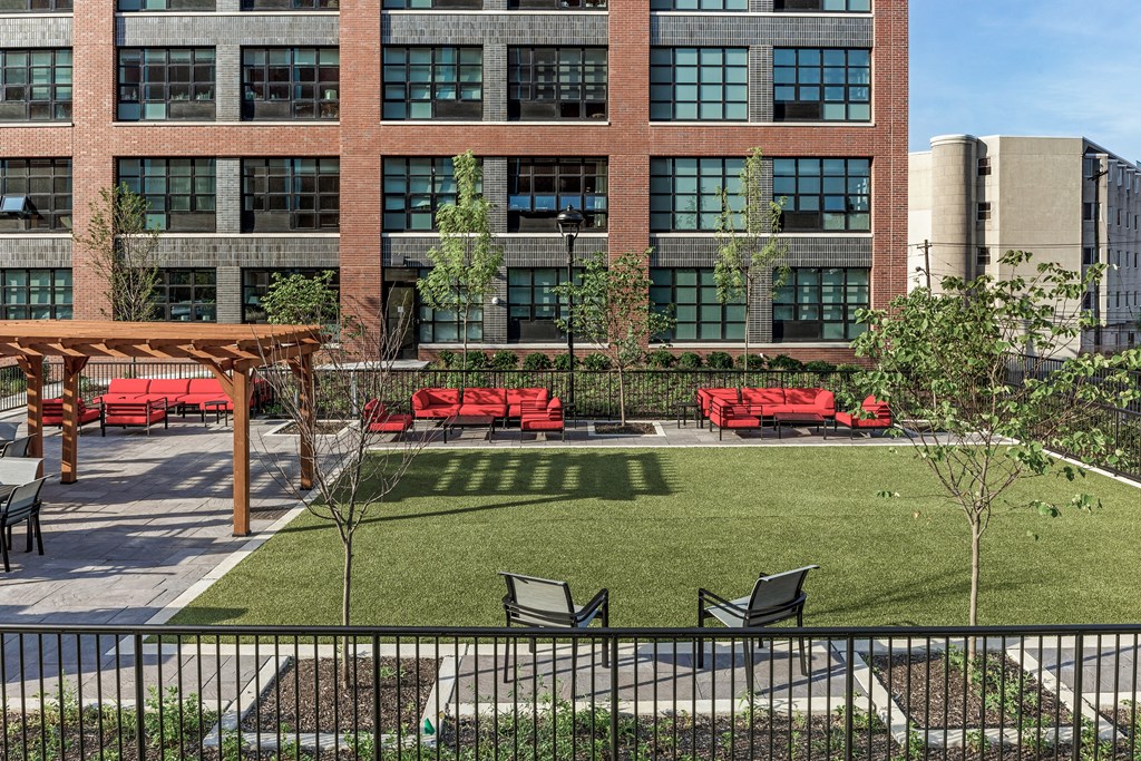 Outdoor green space for  lounging, games, and barbequing.